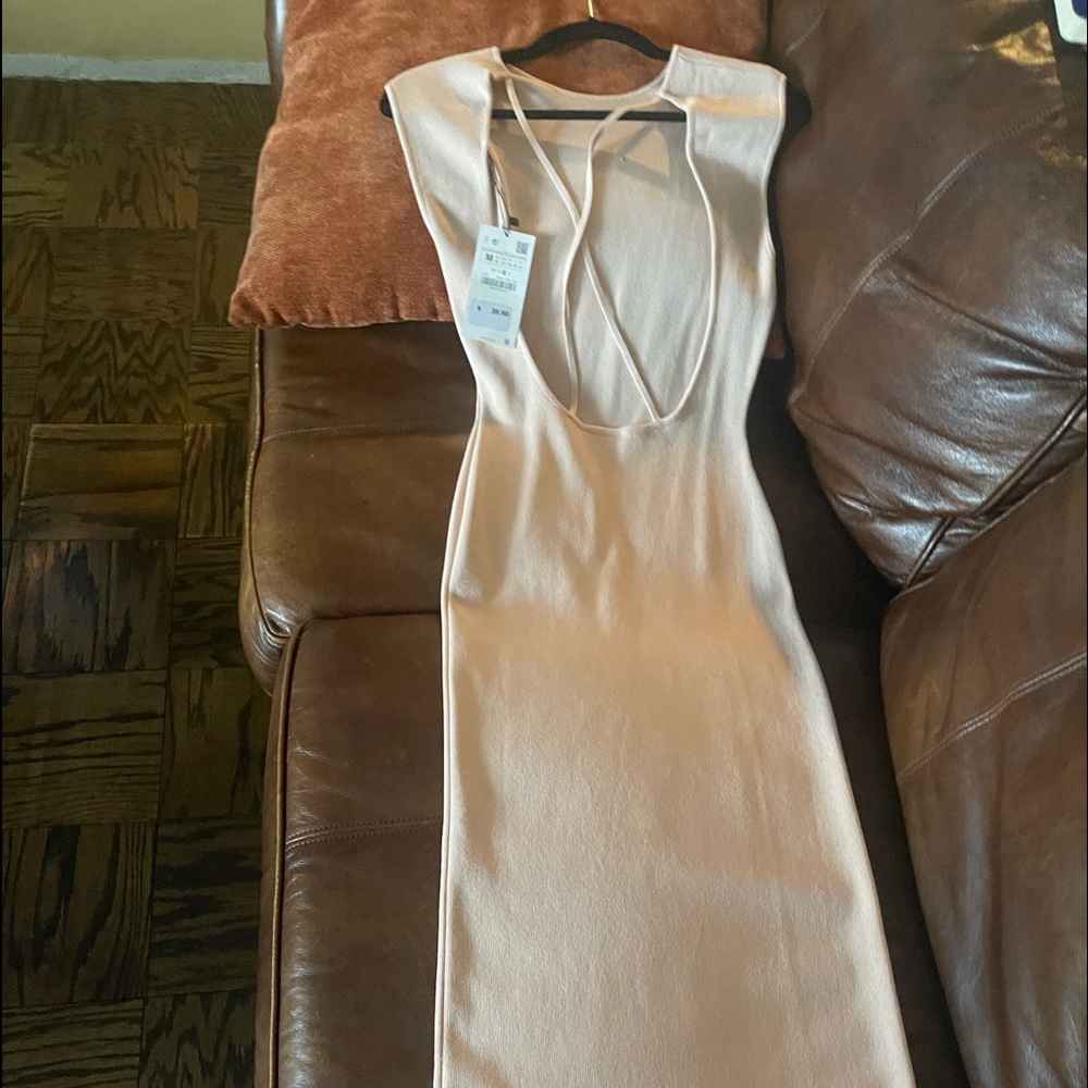 A beige sexy long dress with back out
